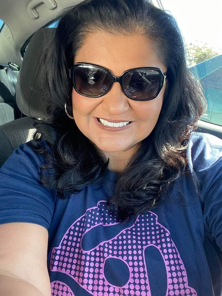 vinyl record adaptor in pink tee shirt